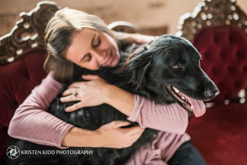 dog being hugged during philadelphia pet photography session for Woman's Best Friend